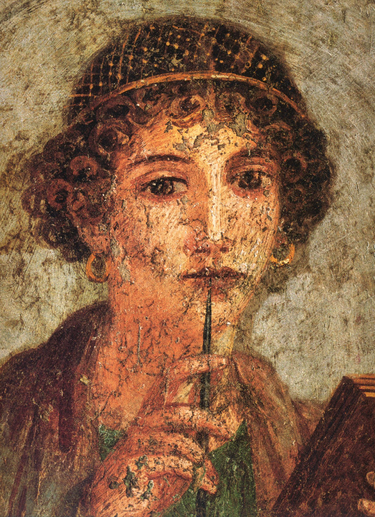 Image of Sappho - woman holding stylus (pen) and codex (book) holding pen to face as if lost in contemplative thought, detail of a frieze of Sappho from Pompeii 