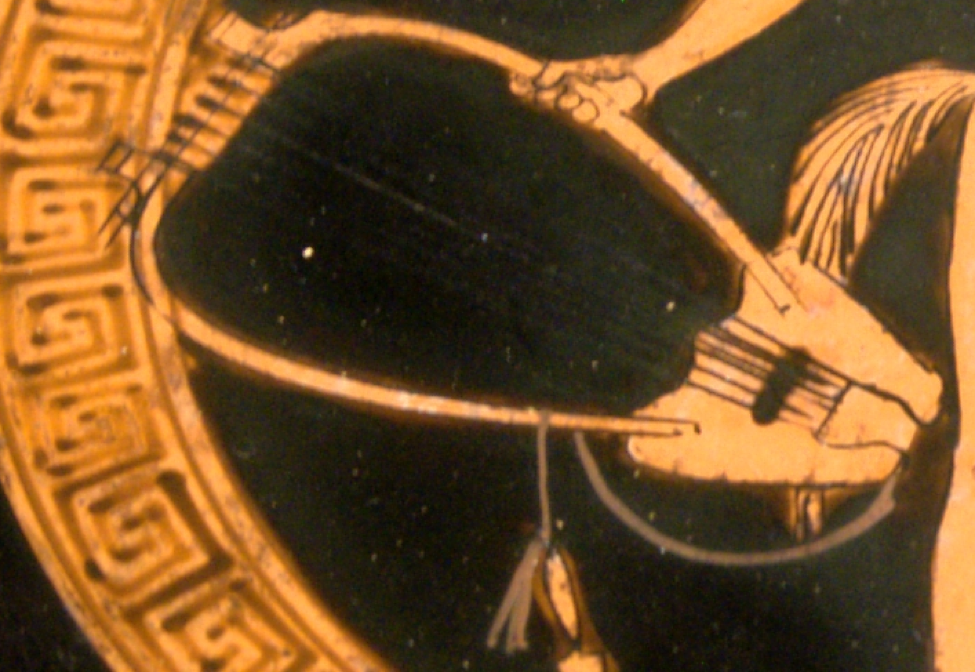 Detail from red figure vase of a satyr holding a barbitos