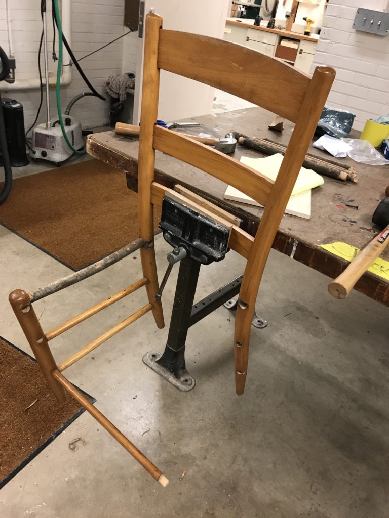 Wooden chair being dismantled