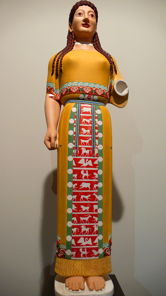 image of a reconstructed version of the Peplos Kore, showing a painted statue of a young woman in a peplos